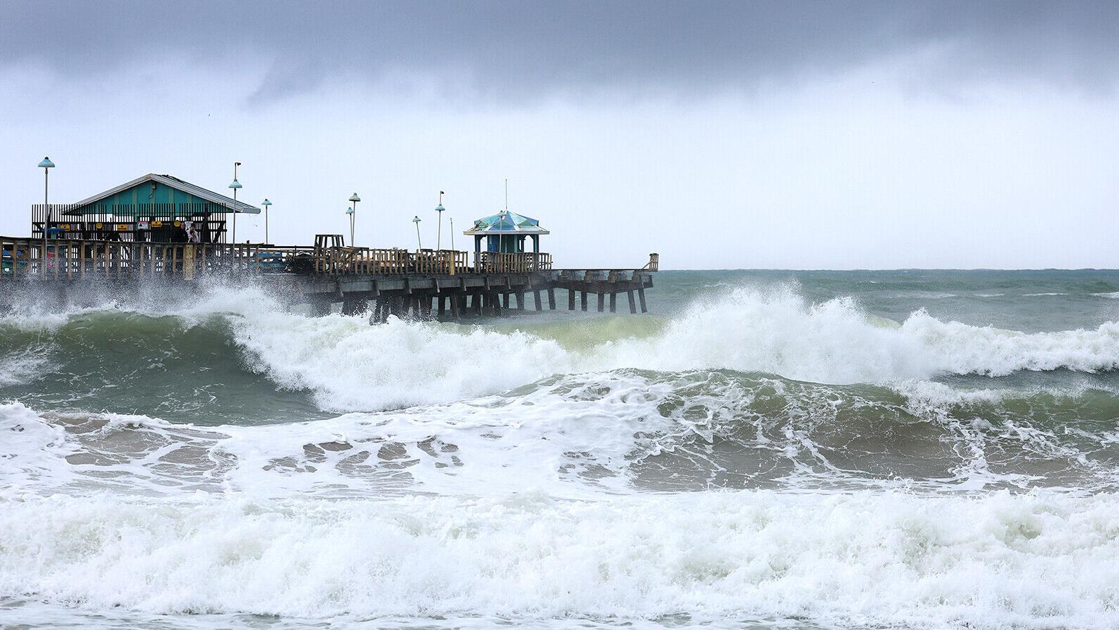 Nicole weakens to a tropical storm after striking Florida's east coast as the first US hurricane in November in nearly 40 years